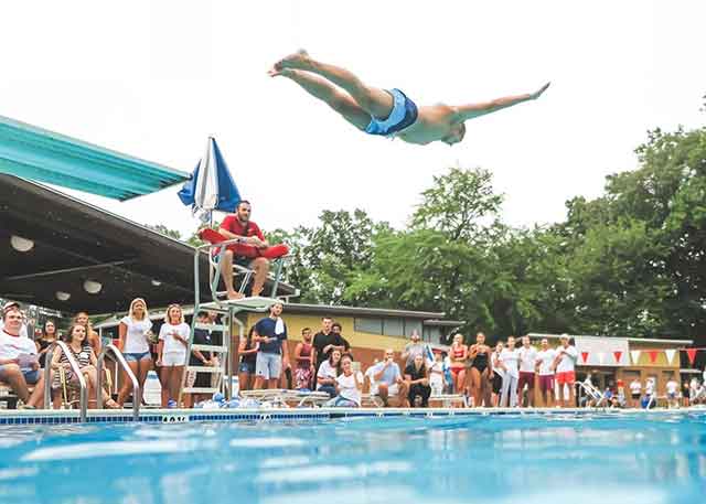 Picture of the swimmer jumping in the pool